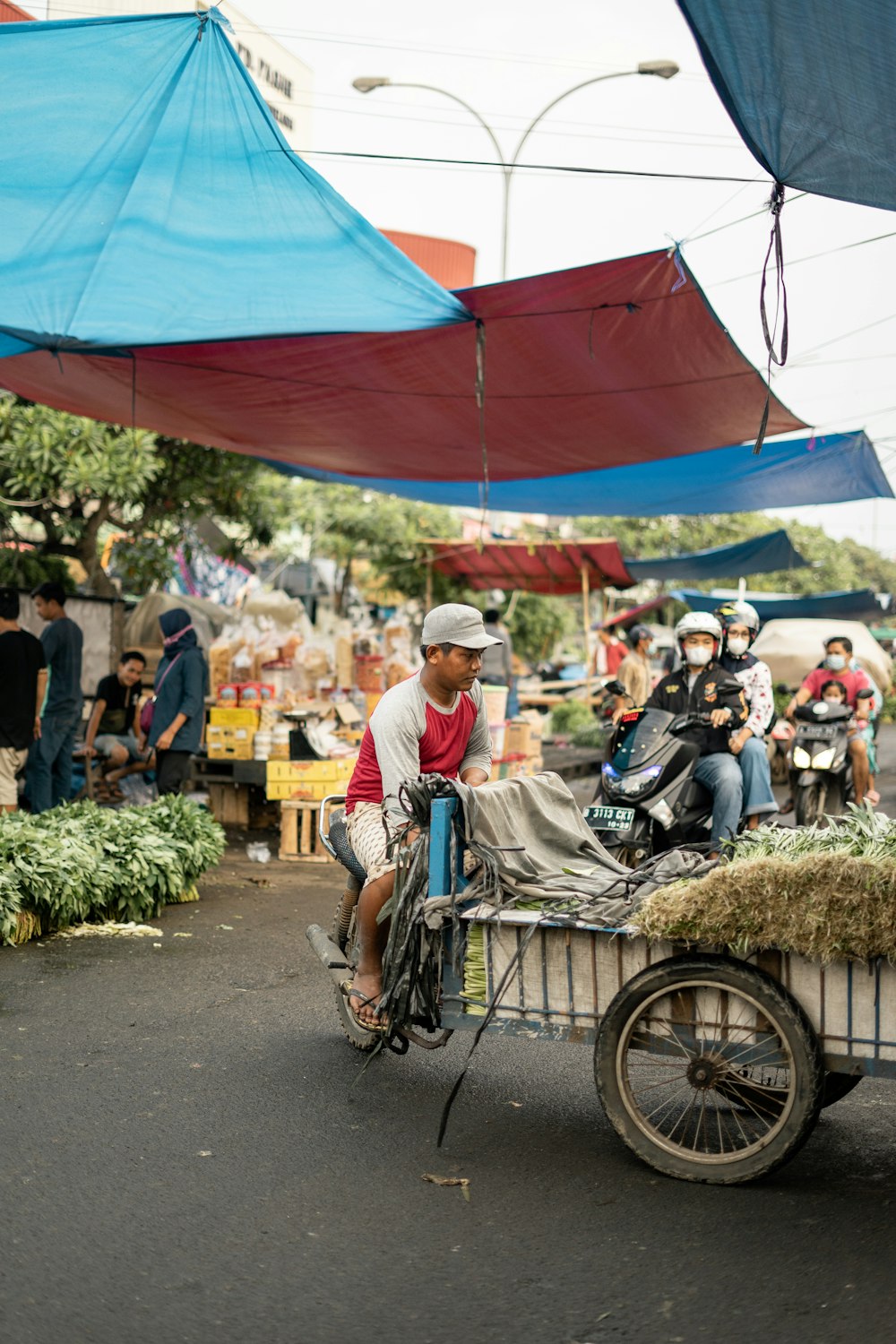 people on street with food display during daytime