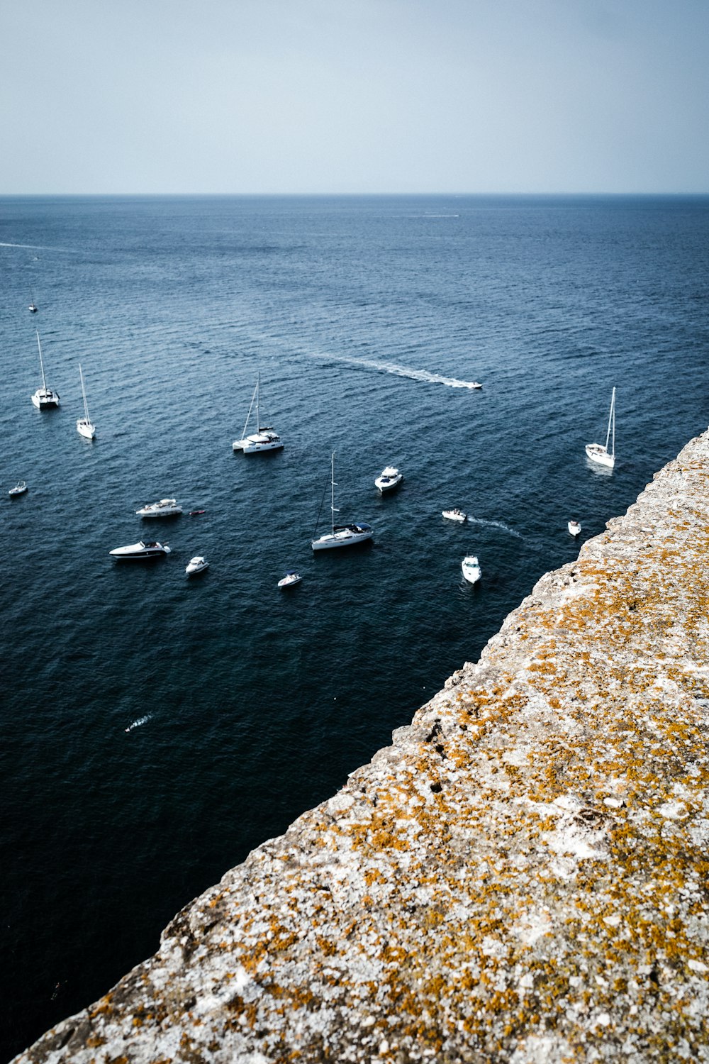 white boats on sea during daytime