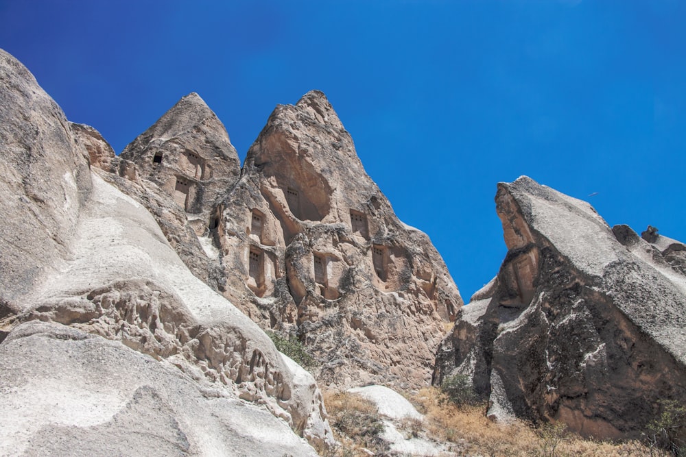 brown rocky mountain under blue sky during daytime