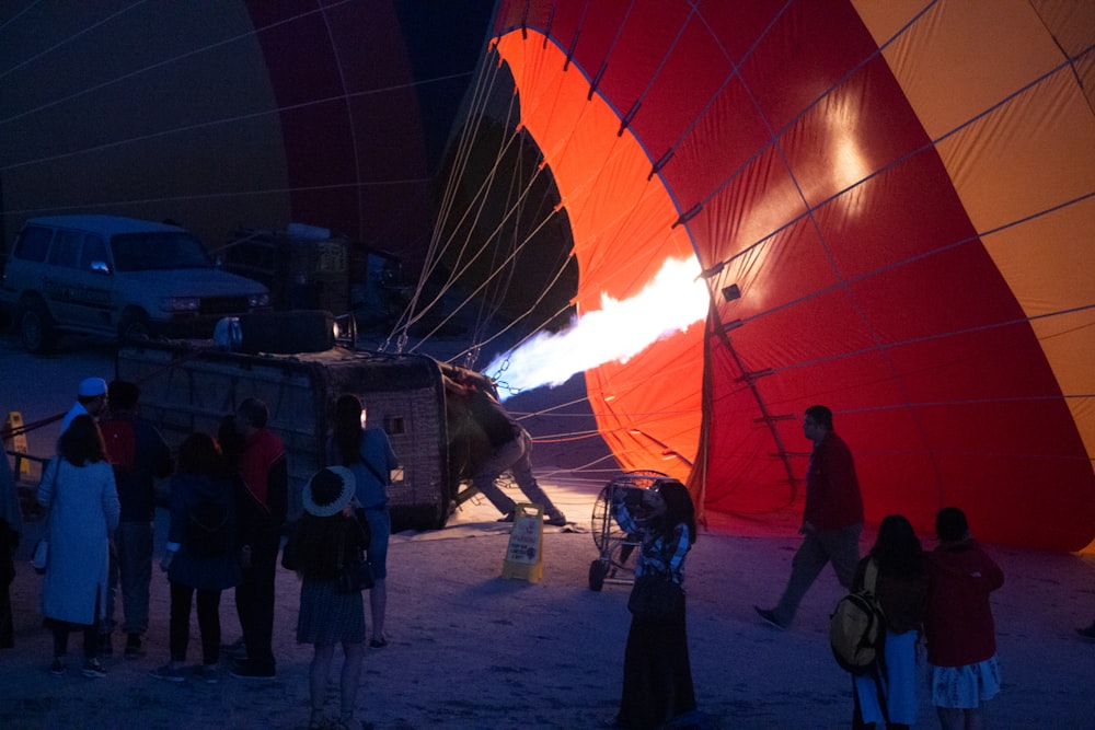 people standing near hot air balloons during daytime