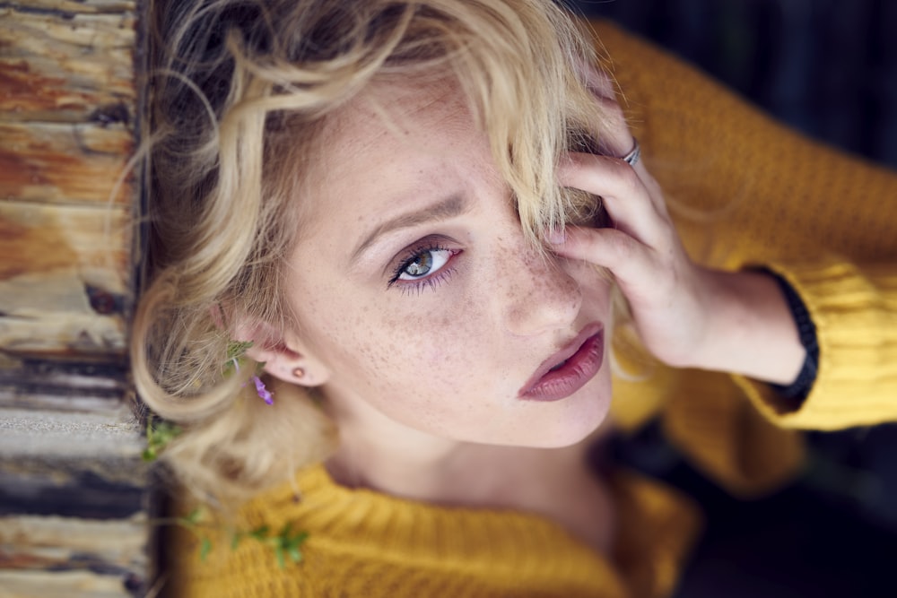 woman in yellow knit sweater