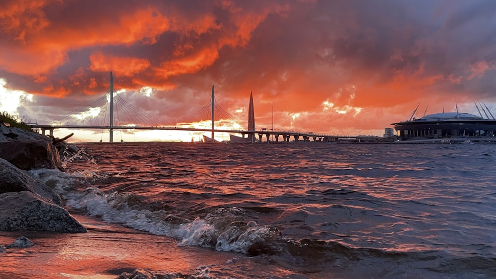 bridge over water during sunset