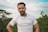 man in white crew neck t-shirt smiling