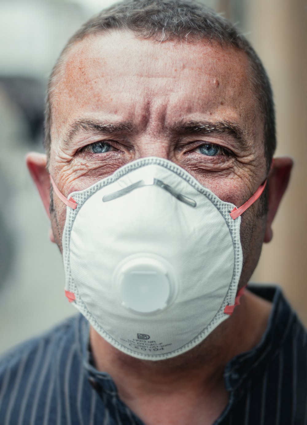 man in white face mask