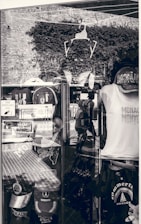 Close-up image of AS Monaco official merchandise including jerseys and scarves.