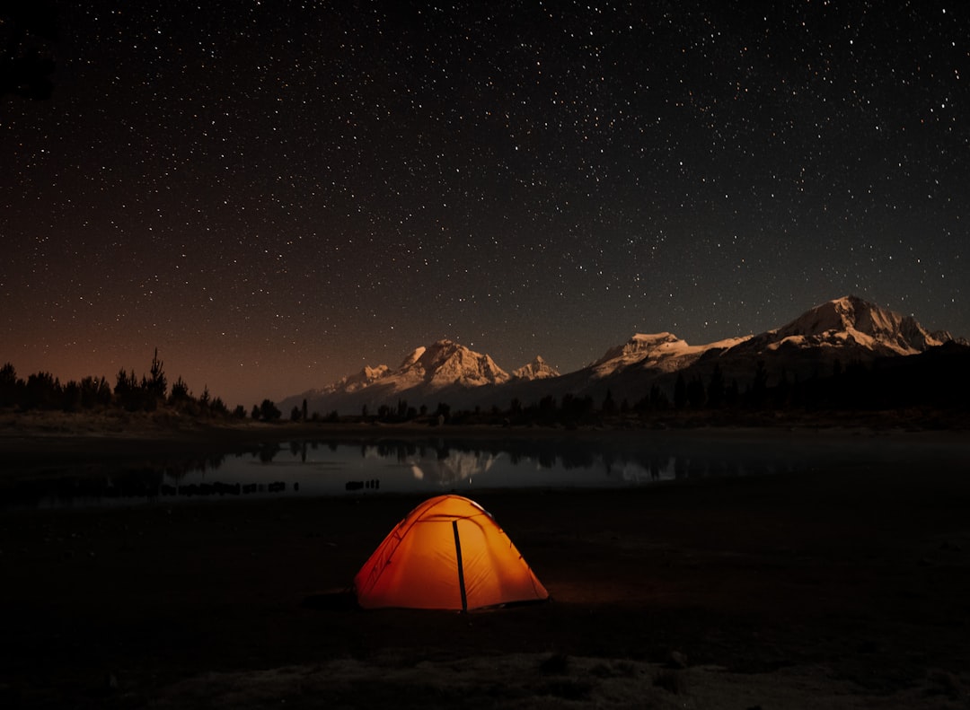 yellow tent on snow covered ground during night time