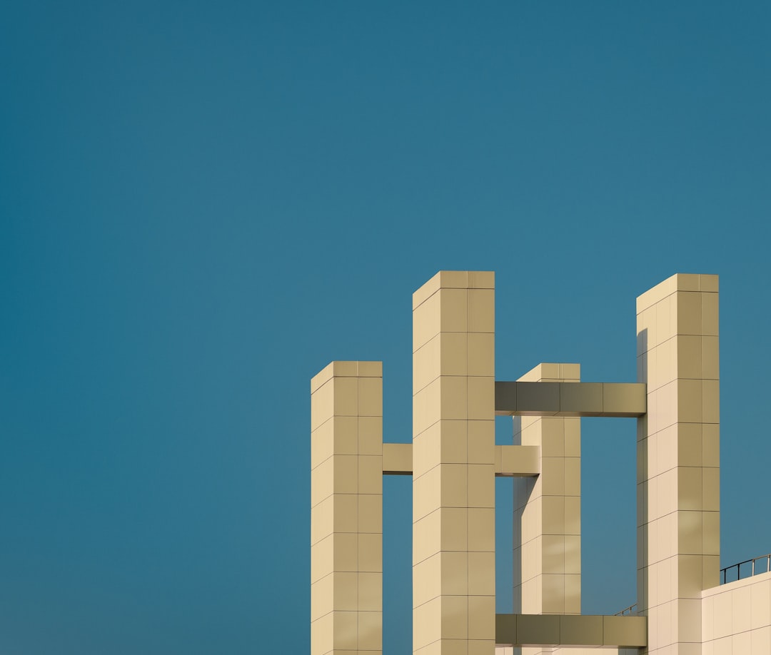 white concrete building under blue sky during daytime