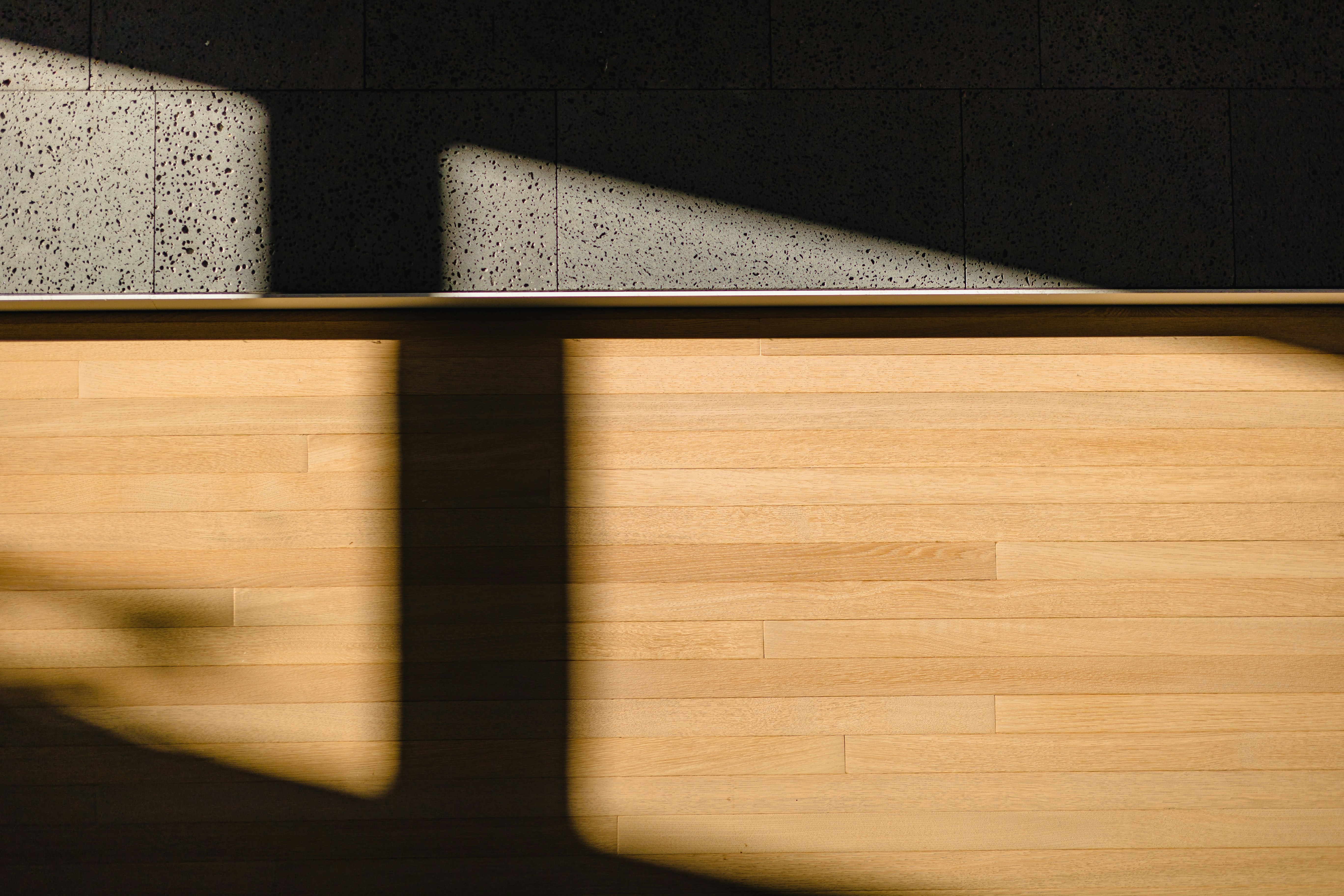 Image of a lift-top coffee table with storage, shown in both its lowered and raised positions - tiny apartment layout