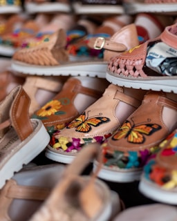 white and brown leather sandals