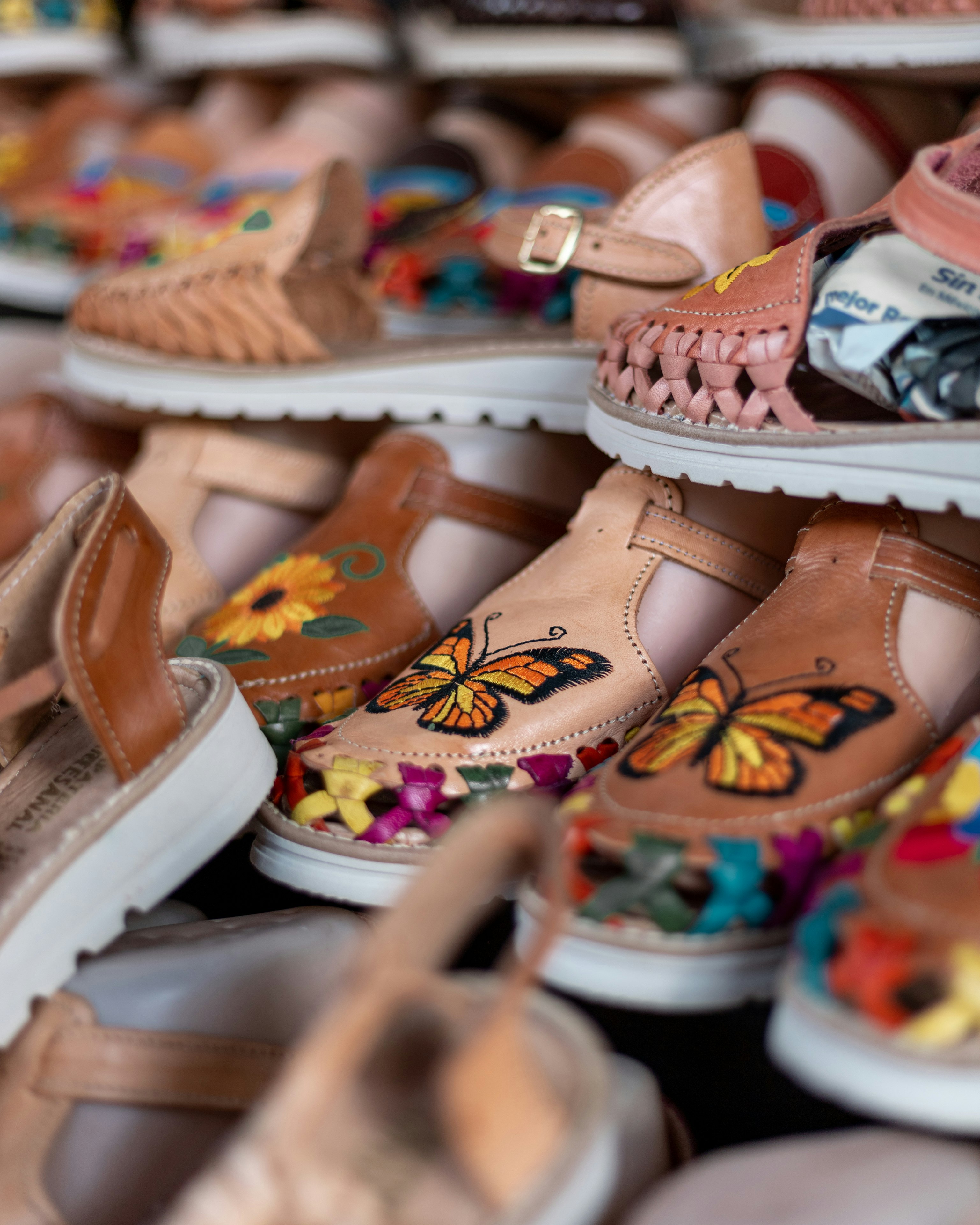 white and brown leather sandals