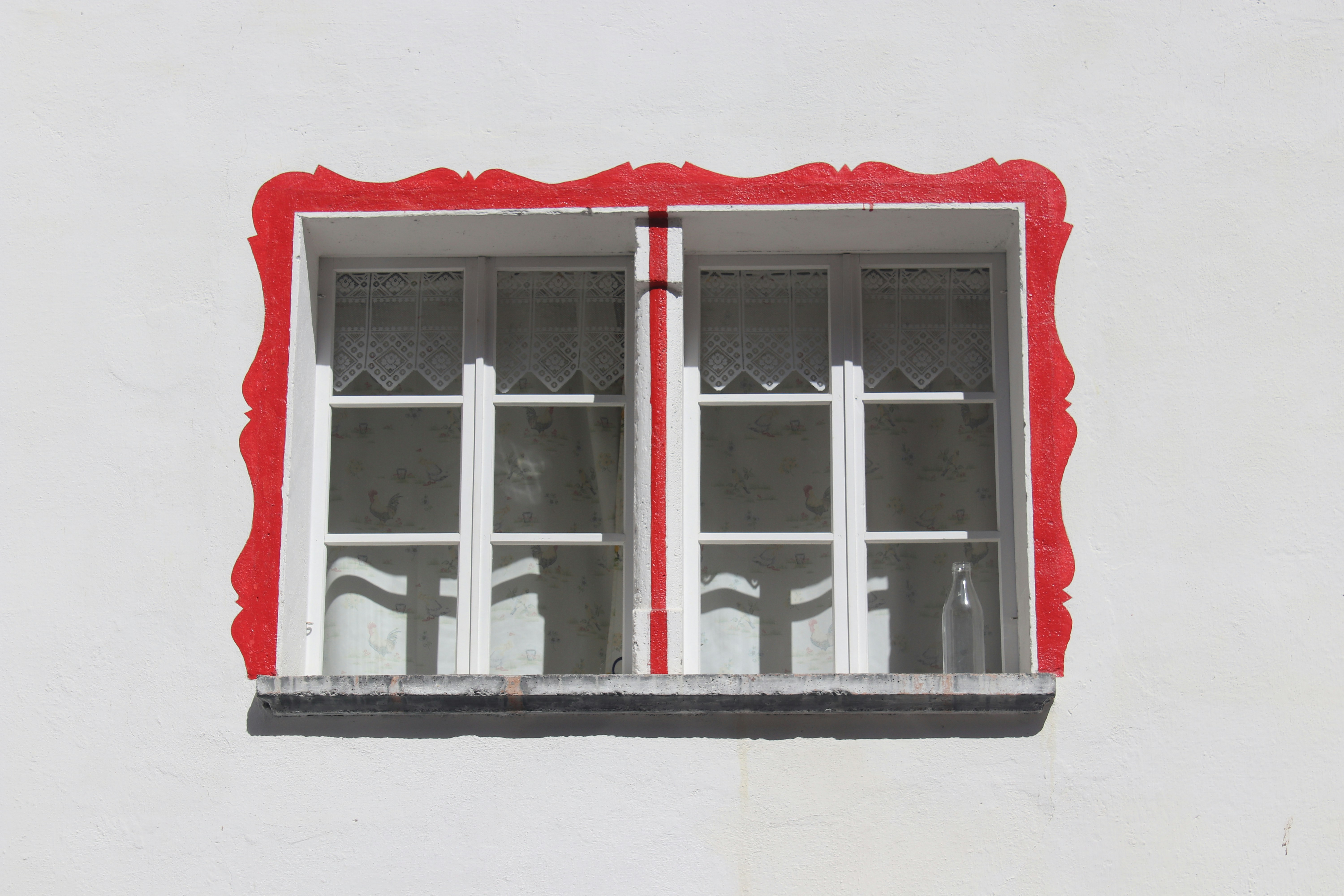white wooden framed glass window