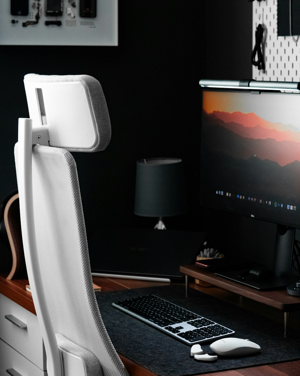 black flat screen computer monitor on brown wooden desk