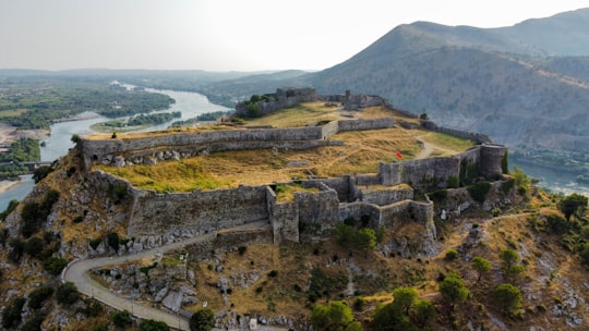 brown and green mountain under white sky during daytime in Rozafa Castle Albania