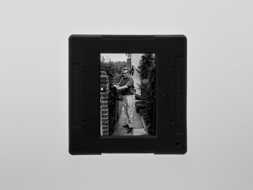 black wooden framed photo of man and woman