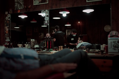 man in black jacket sitting on chair