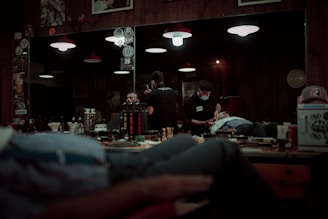 man in black jacket sitting on chair