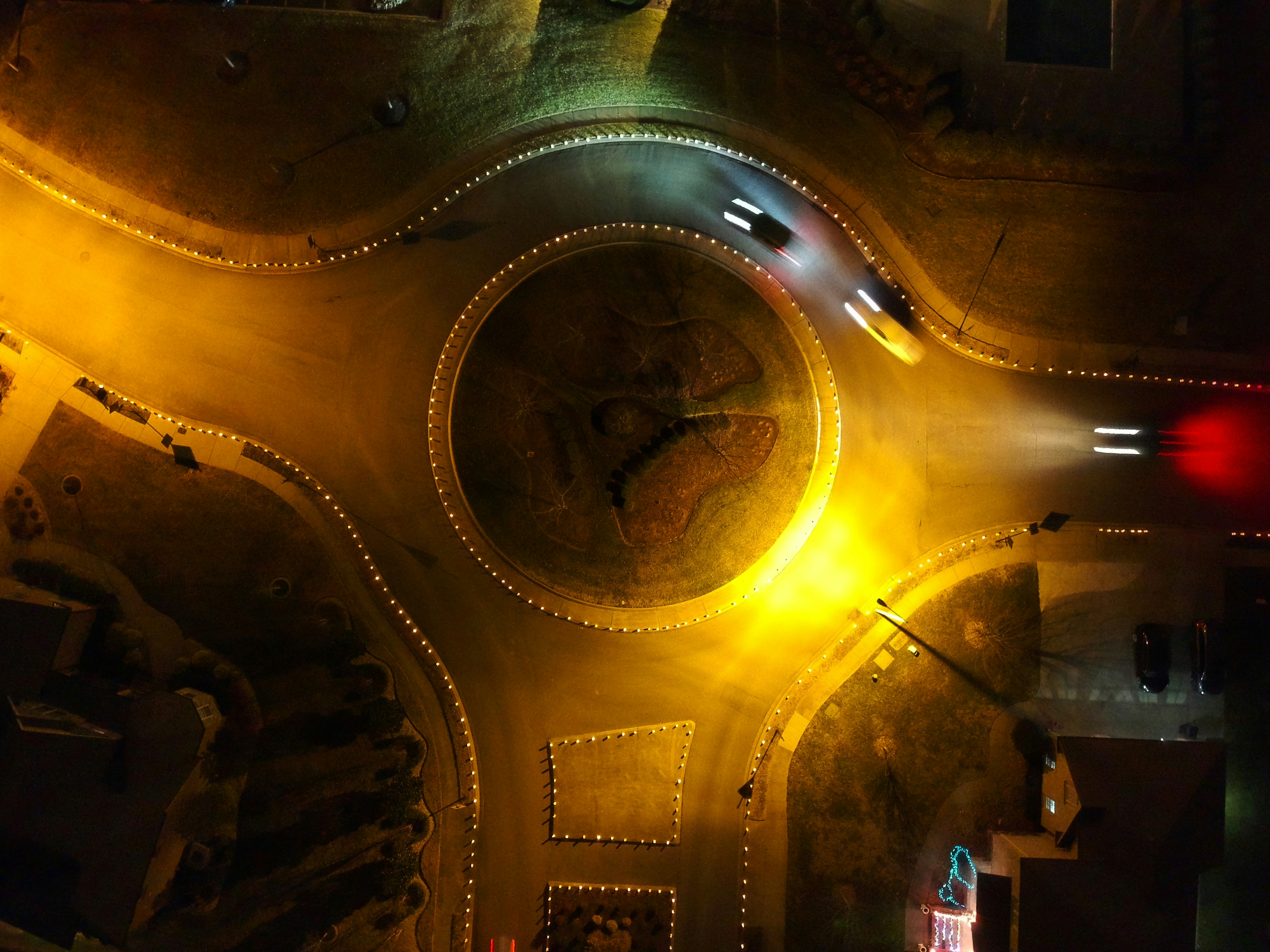 Roundabout at night photographed from above.