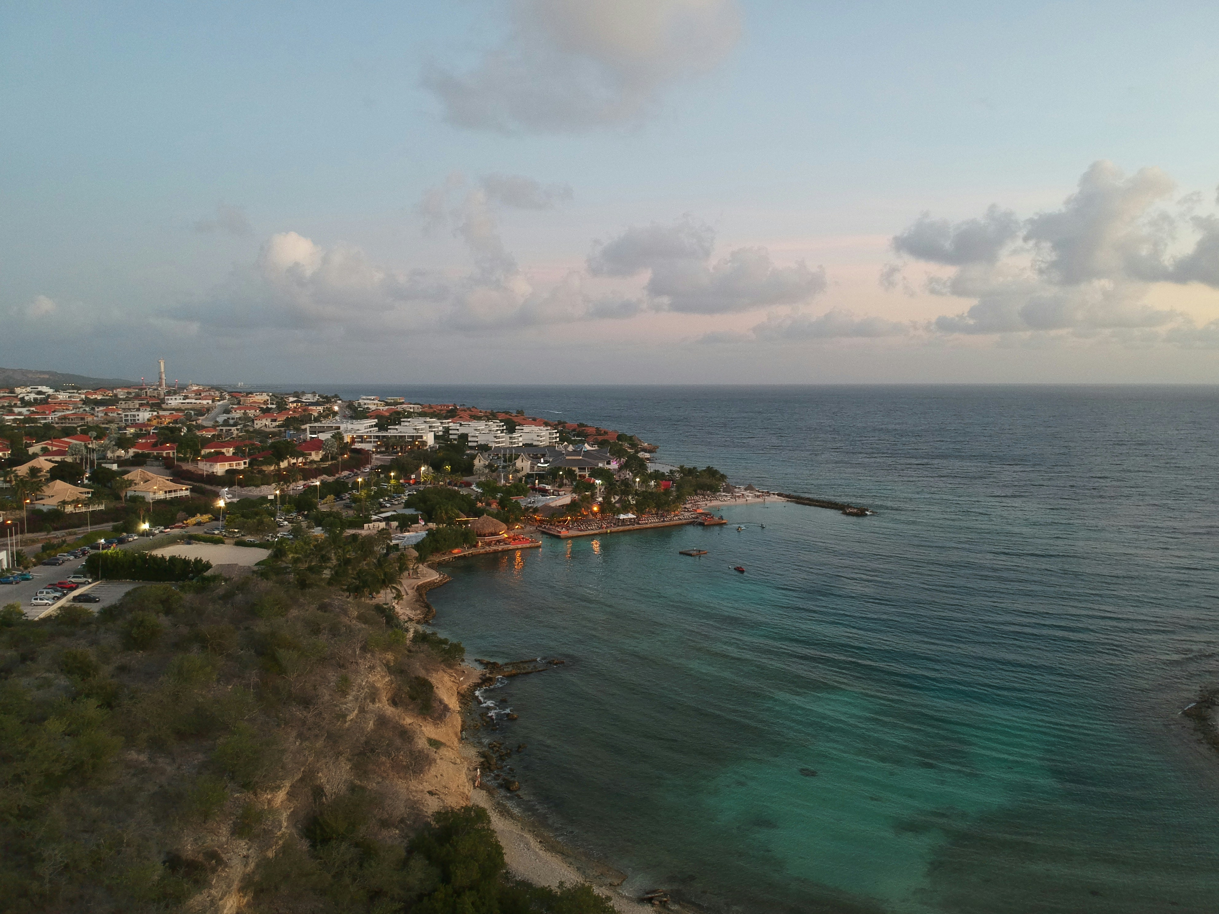 aerial view of city near body of water during daytime