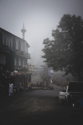 A roadside scene with a car emitting steam from the hood and a concerned man standing beside it, set against a backdrop of Florence, SC.
