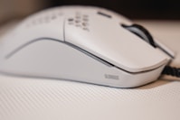 white and black cordless computer mouse
