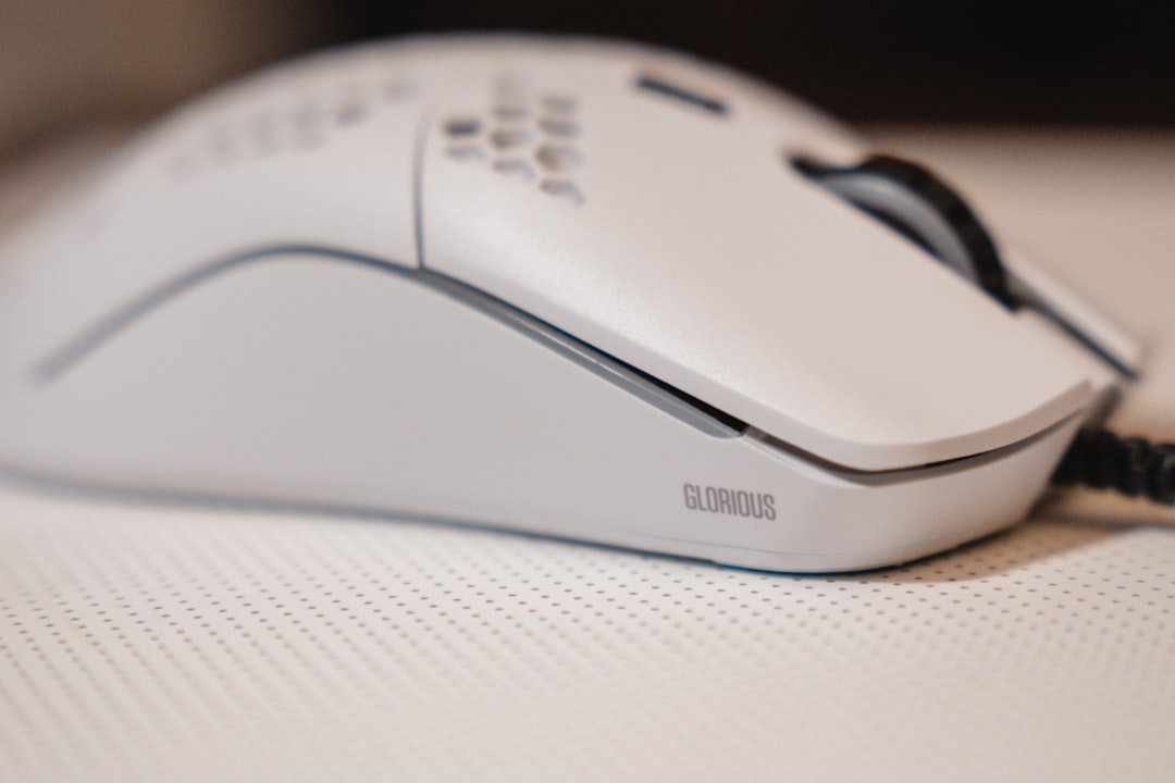 white and black cordless computer mouse