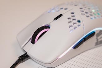 Close-up of a sleek wireless mouse with customizable LED lighting glowing softly.