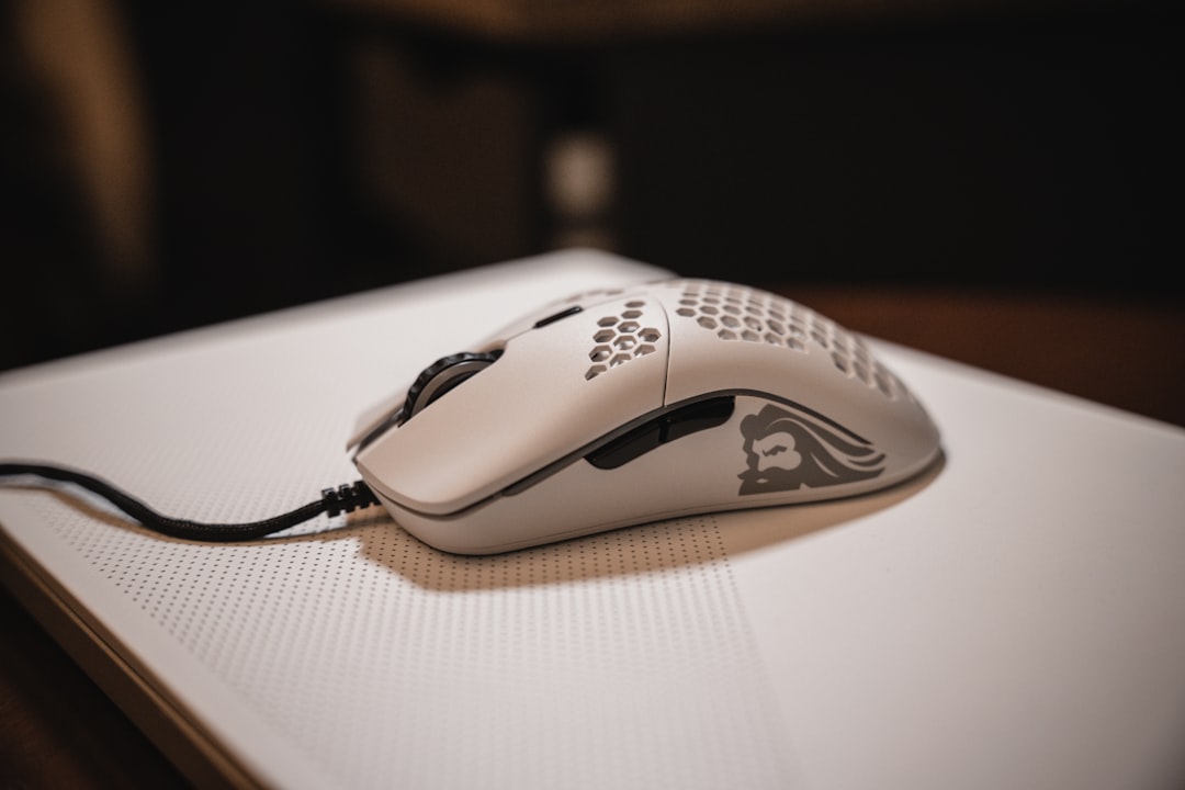 white and black logitech cordless mouse