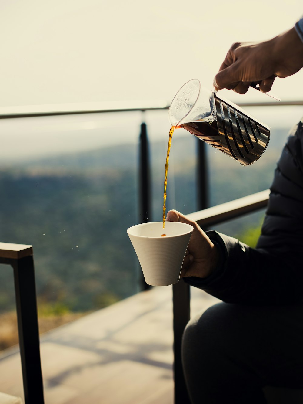 person holding white ceramic mug