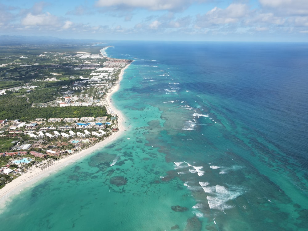 aerial view of city near body of water during daytime