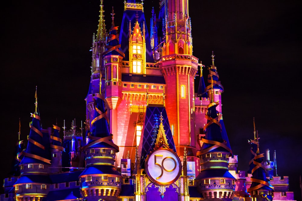 brown and blue lighted castle during night time