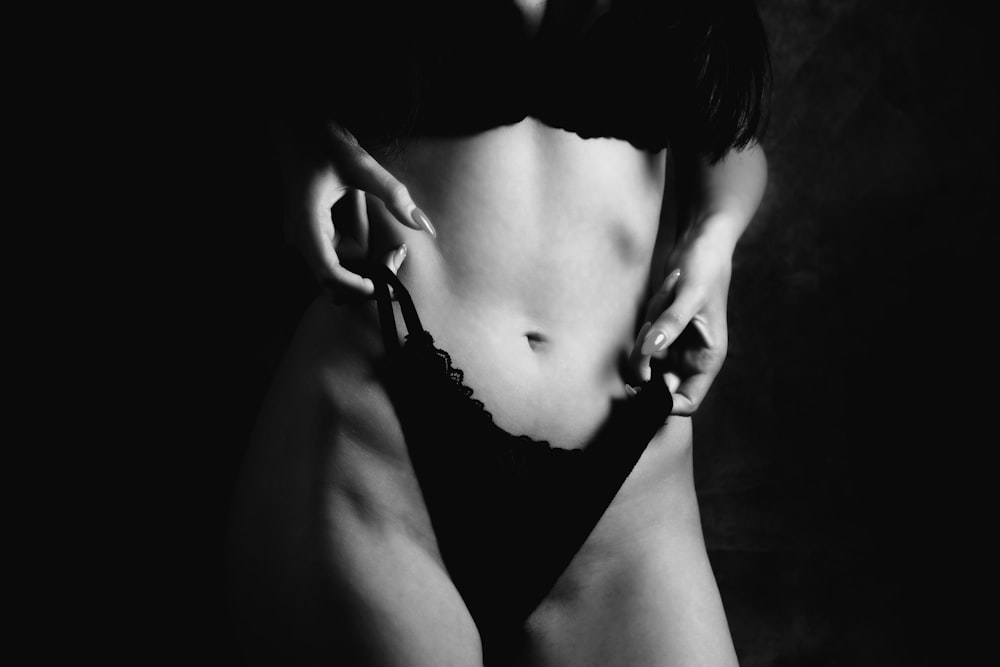 woman in black bikini bottom