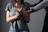 woman in gray scoop neck shirt holding her hands