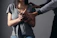 woman in gray scoop neck shirt holding her hands