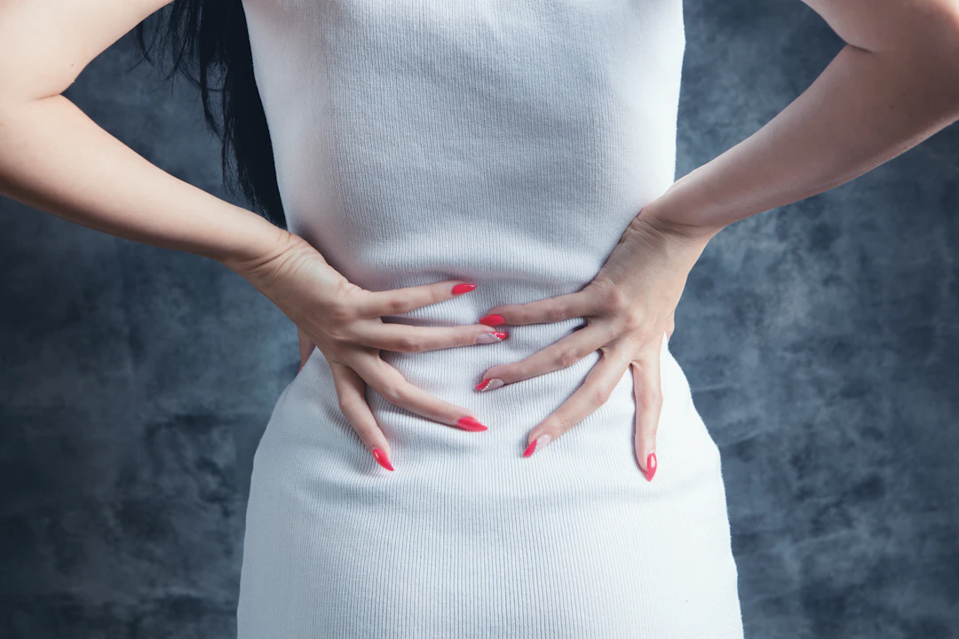 Woman with tummy discomfort from constipation