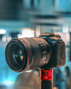 black nikon dslr camera on red stand