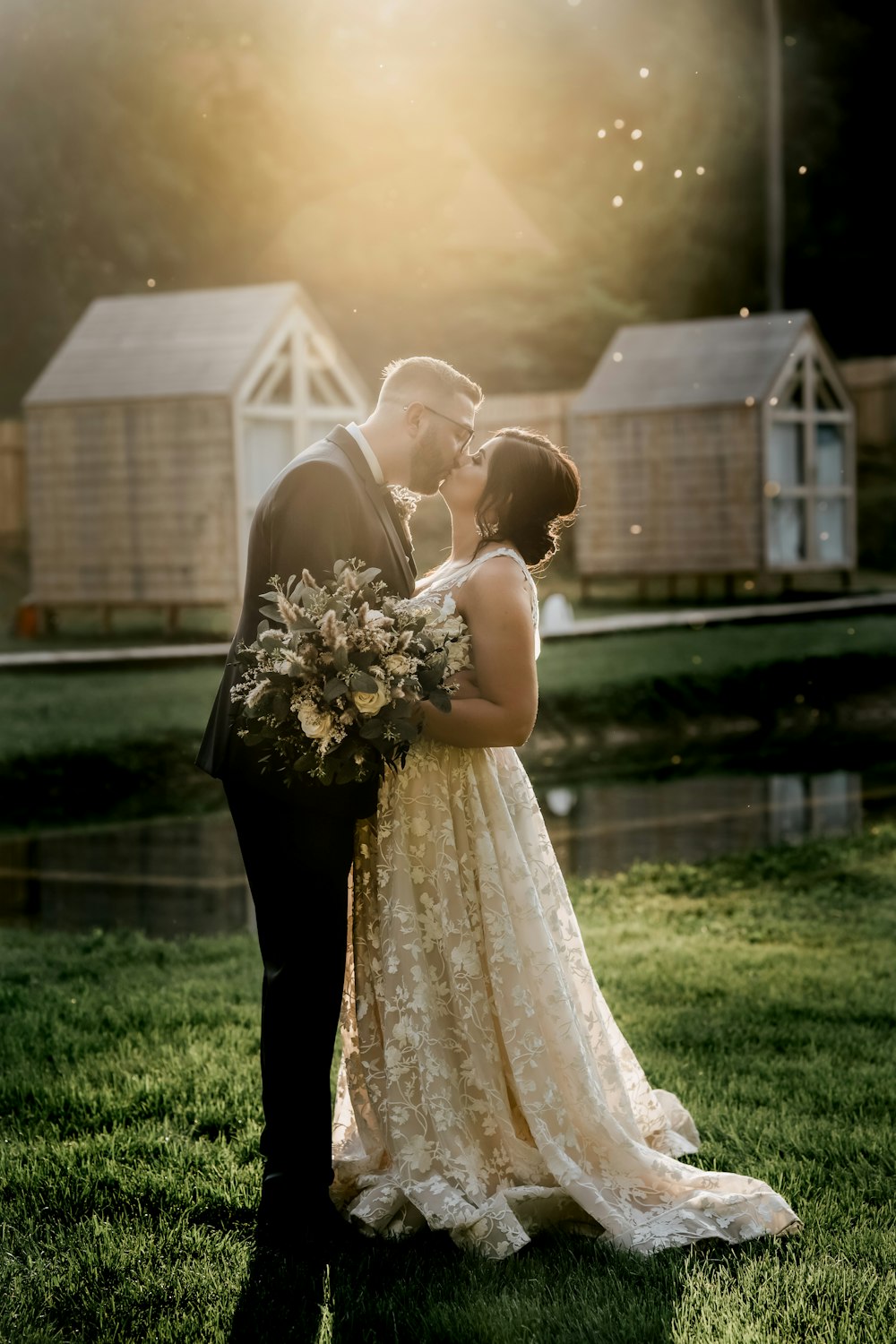 woman in white wedding dress holding bouquet of flowers