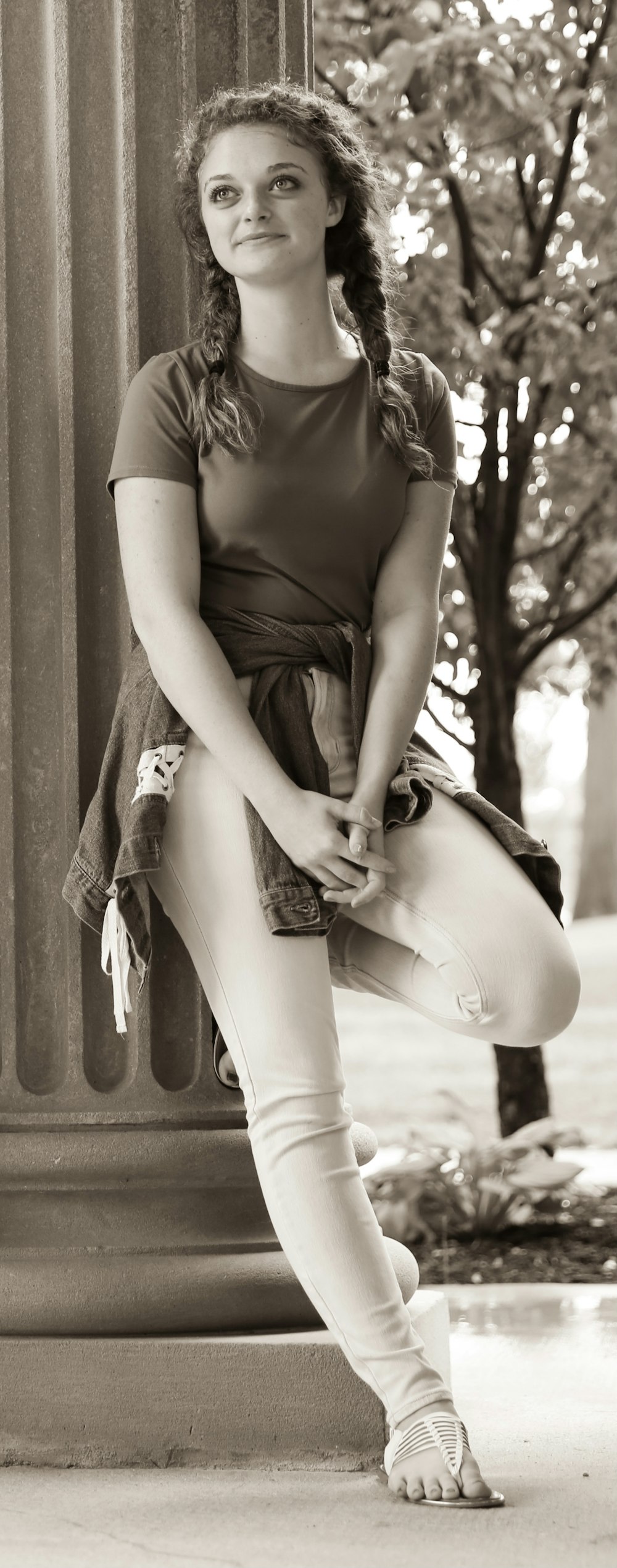 grayscale photo of woman wearing black tank top and skirt