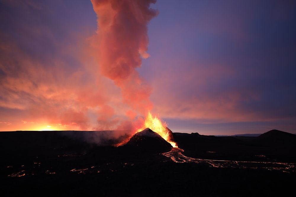 white smoke coming out from a black mountain