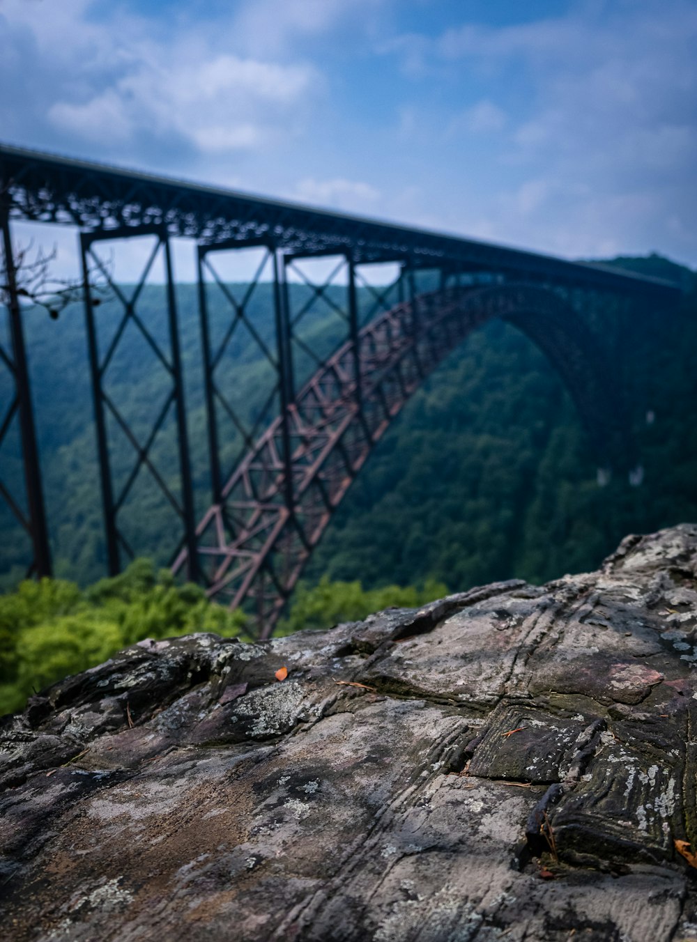 gray metal bridge over river