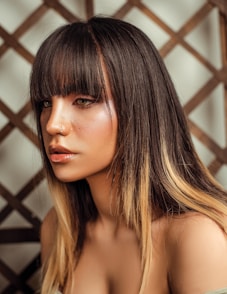 woman with brown hair looking at the camera