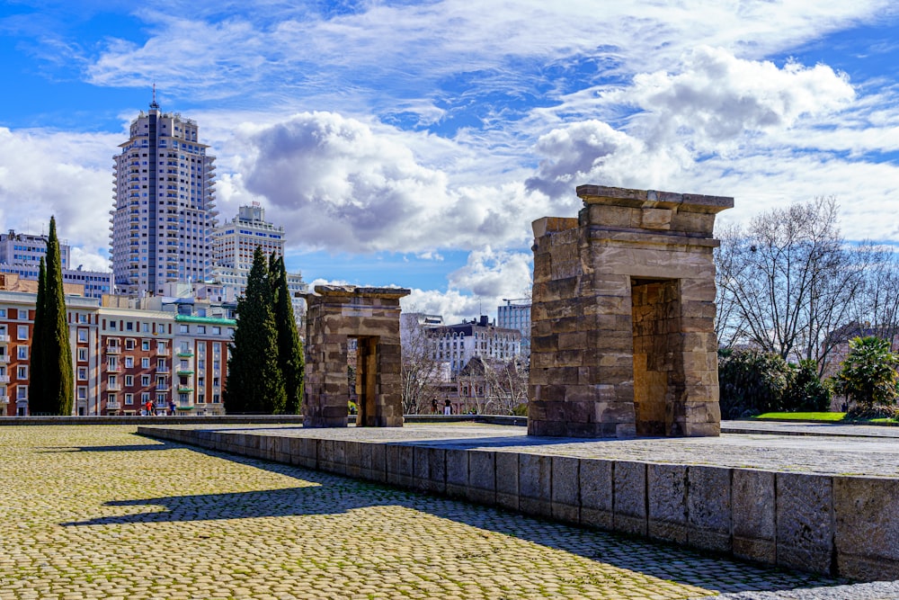 city skyline under blue and white sunny cloudy sky during daytime