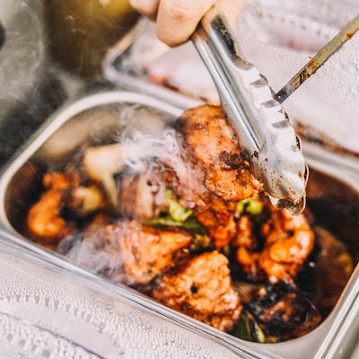 person holding stainless steel fork and knife