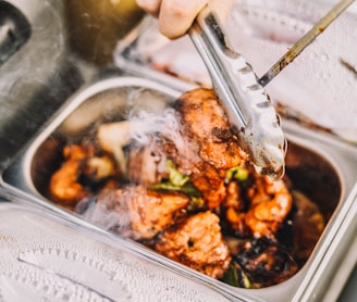 person holding stainless steel fork and knife