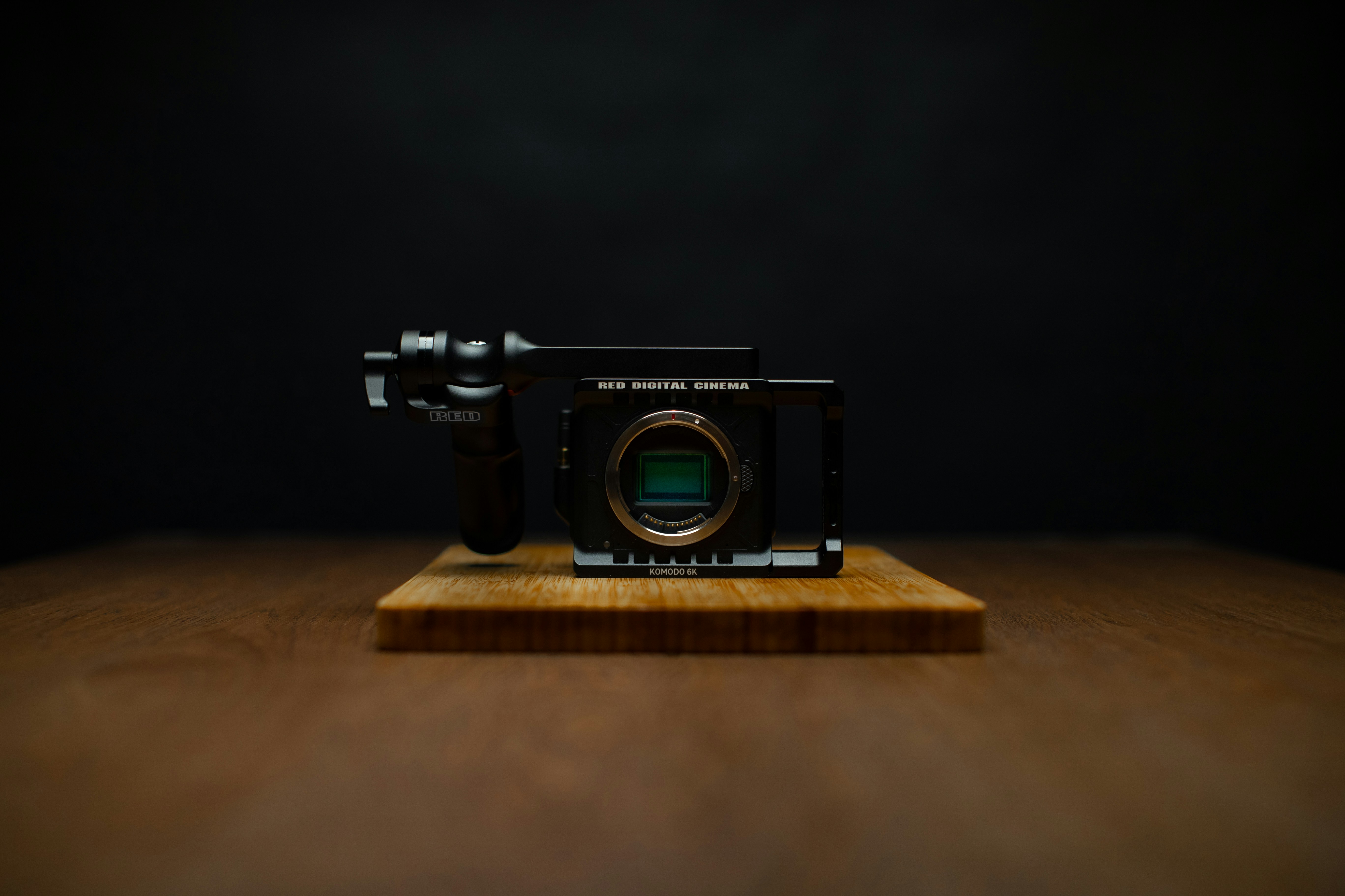 black and silver dslr camera on brown wooden table