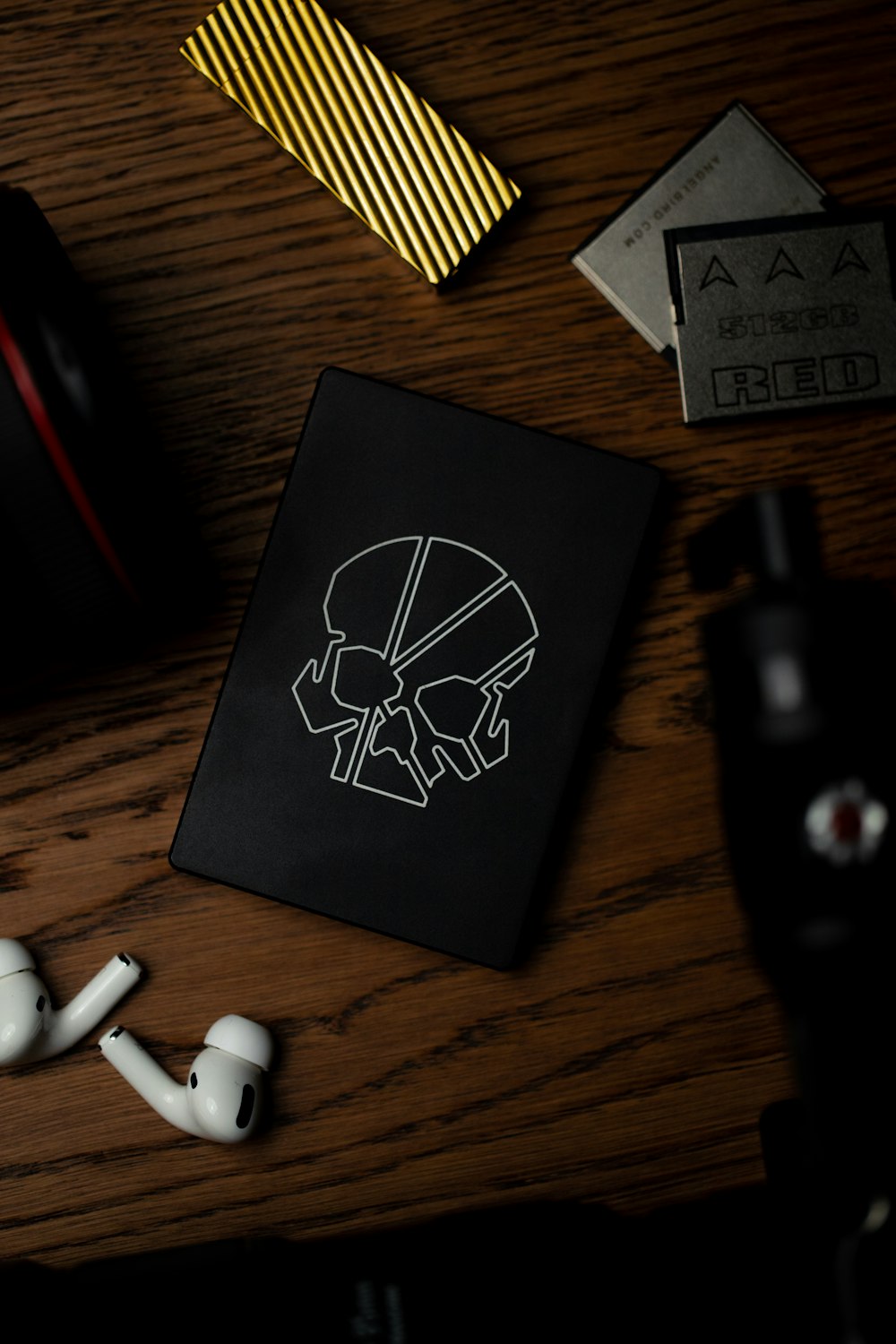 white earbuds on black book