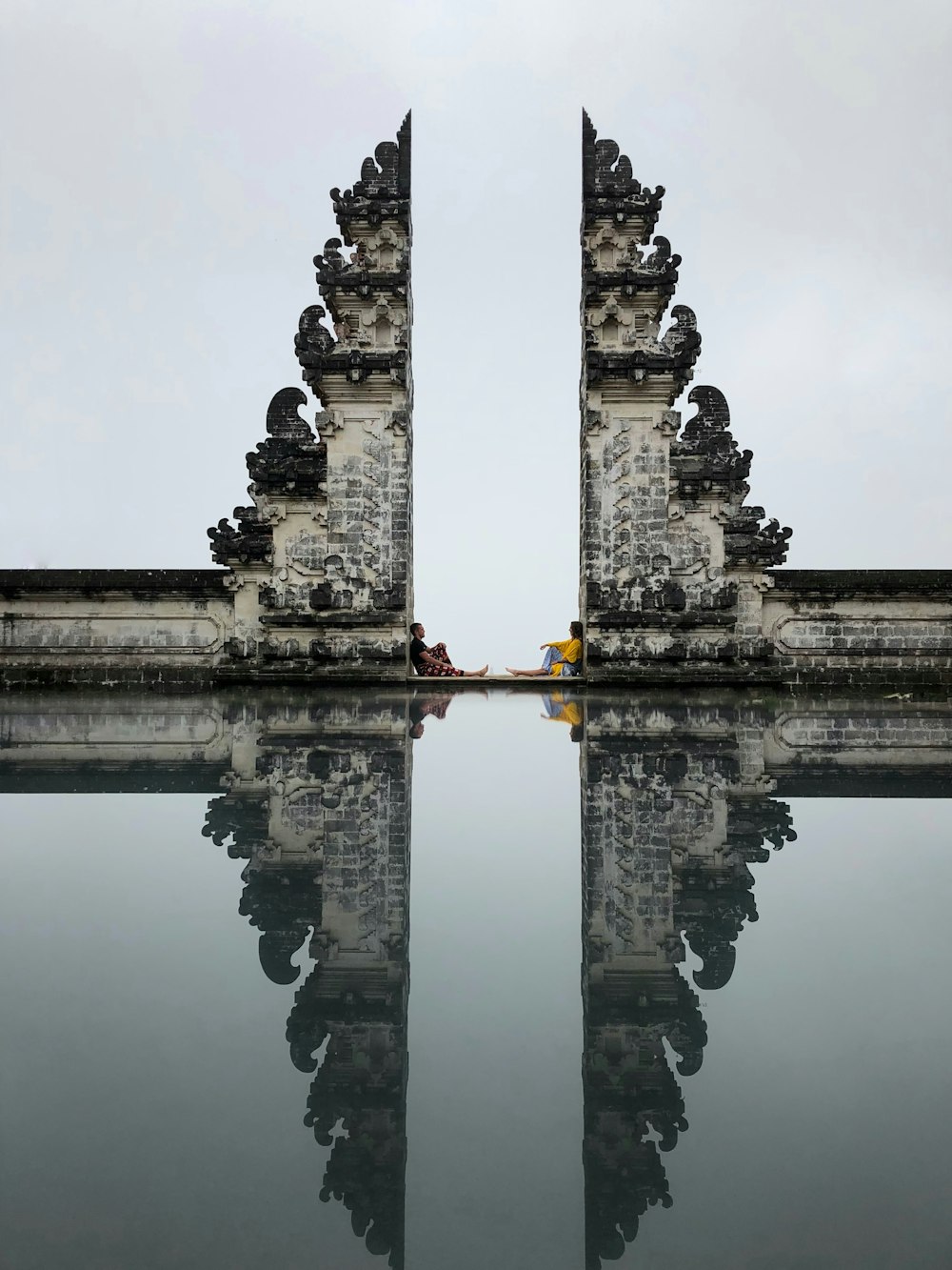 gray concrete pillars on water