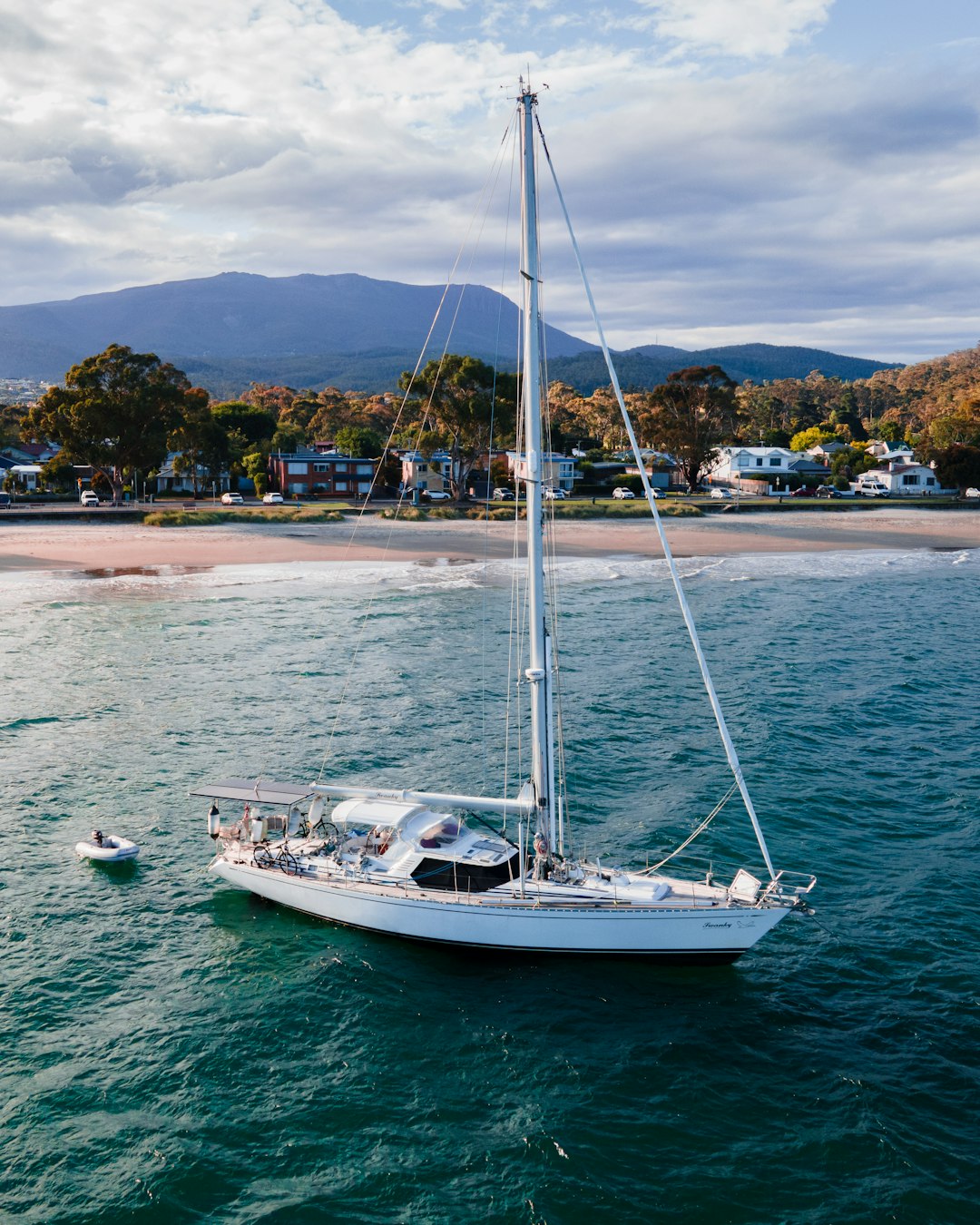 white sail boat on sea during daytime