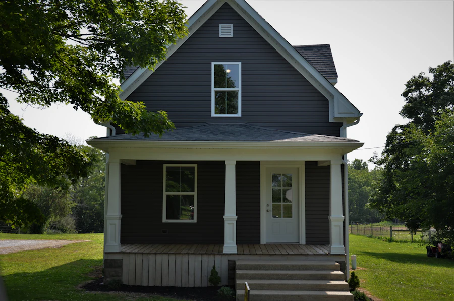 A restored two-story house with a front porch