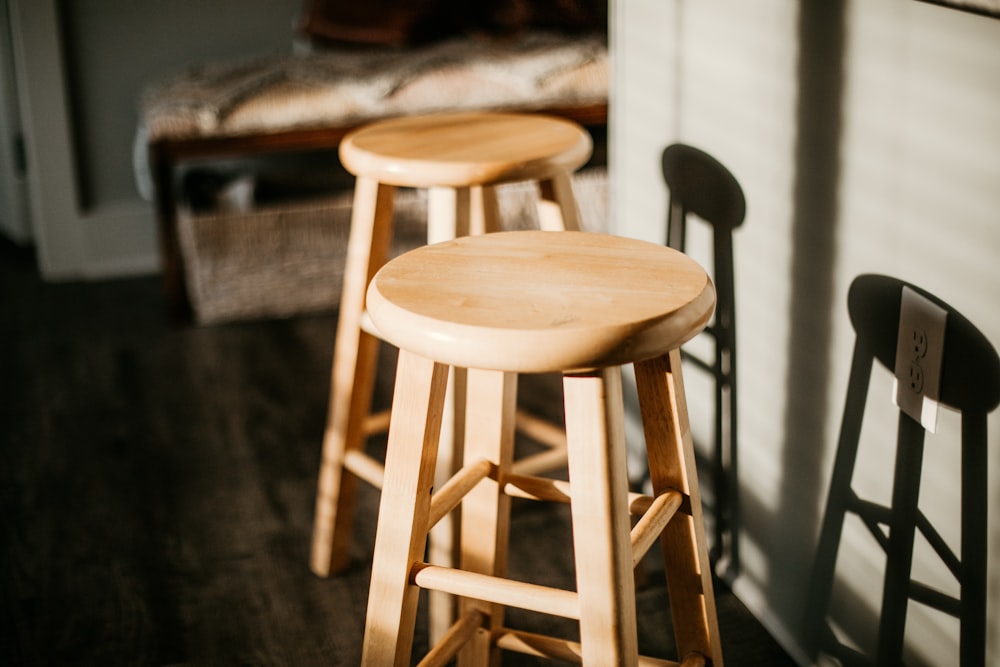 brown wooden seat on black floor