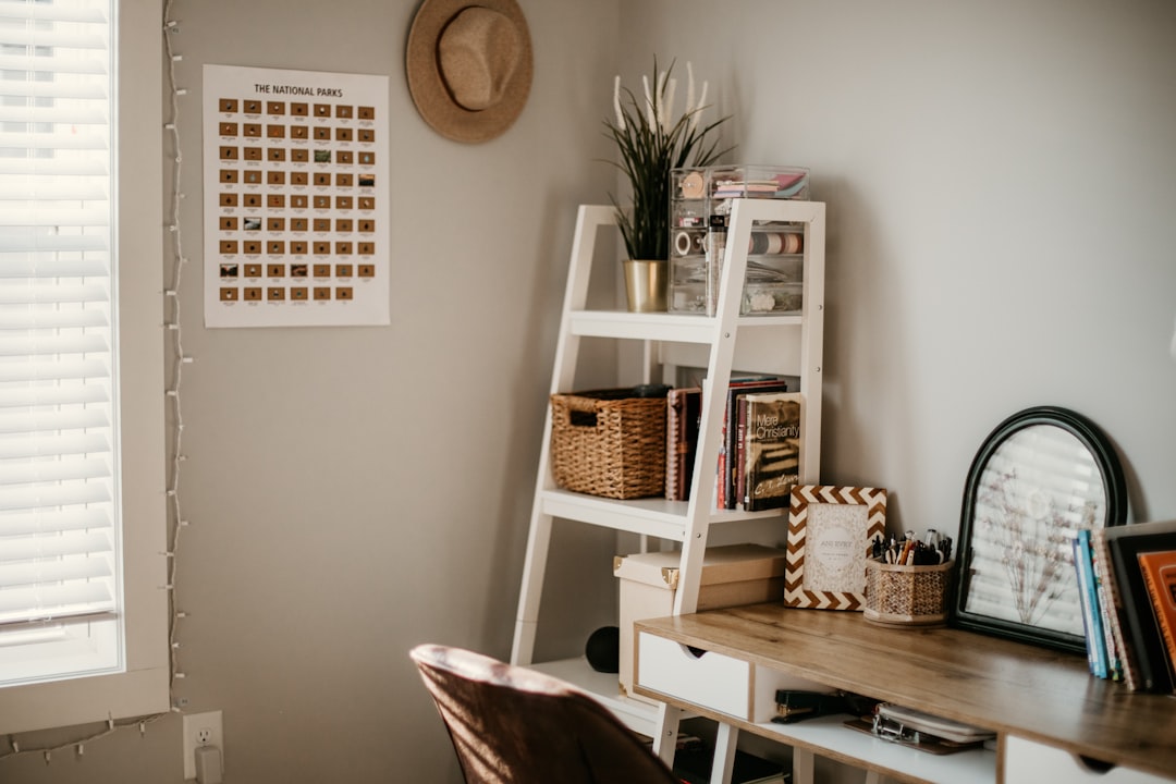 ladder shelf with wicker storage basket and books in a small apartment bedroom